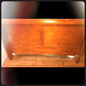 Wooden sleigh bed frame for a queen size.